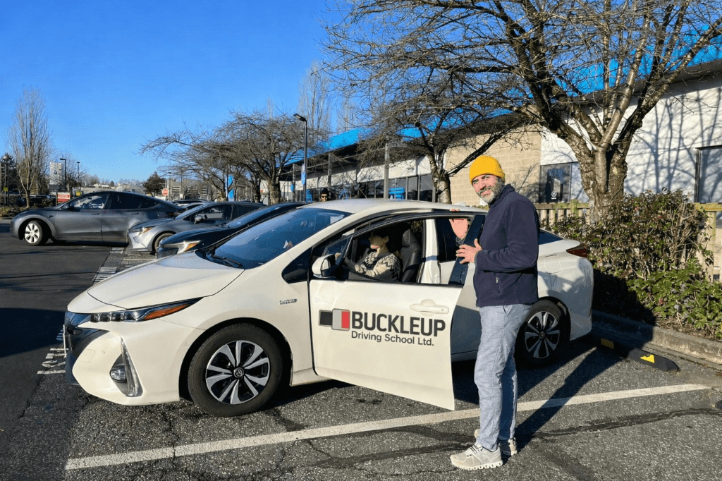 Farhad Sanaeifar with Buckleup Driving School Car